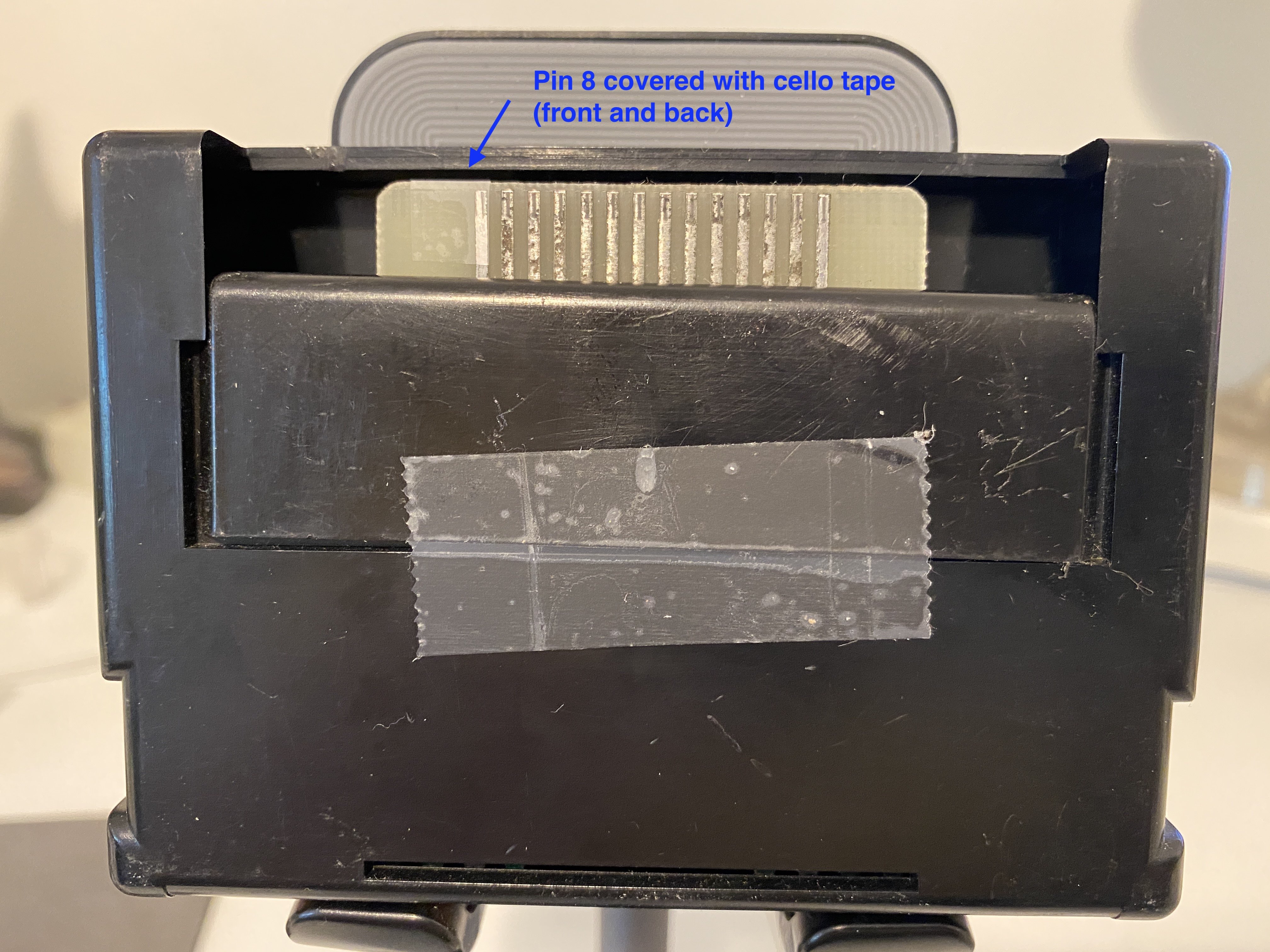 Tape over pin 8 of the cartridge port.